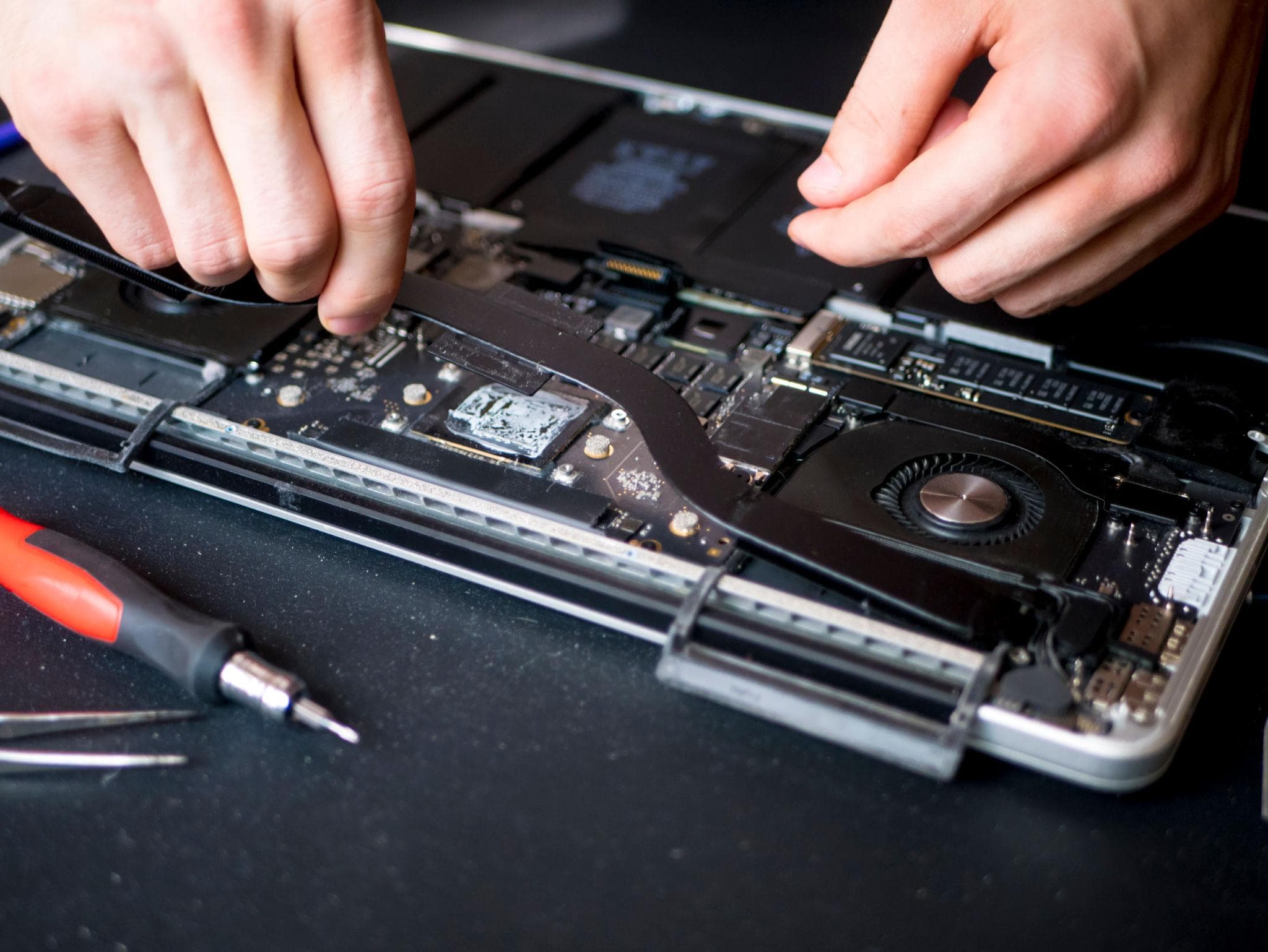 Technician repairing a device at the bench